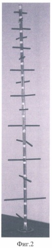Турникетная вибраторная логопериодическая антенна поперечного излучения (патент 2461927)
